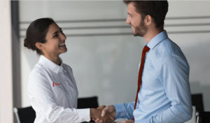 Cleaning operatives shaking hands with a client